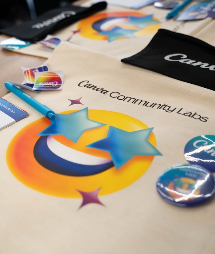 Creative display of Canva Community Labs merchandise showcasing branding and vibrant designs.